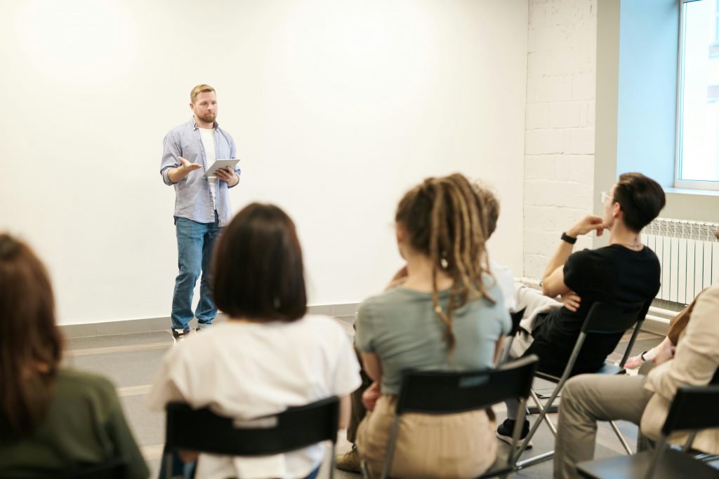 A man giving a presentation to a group of people